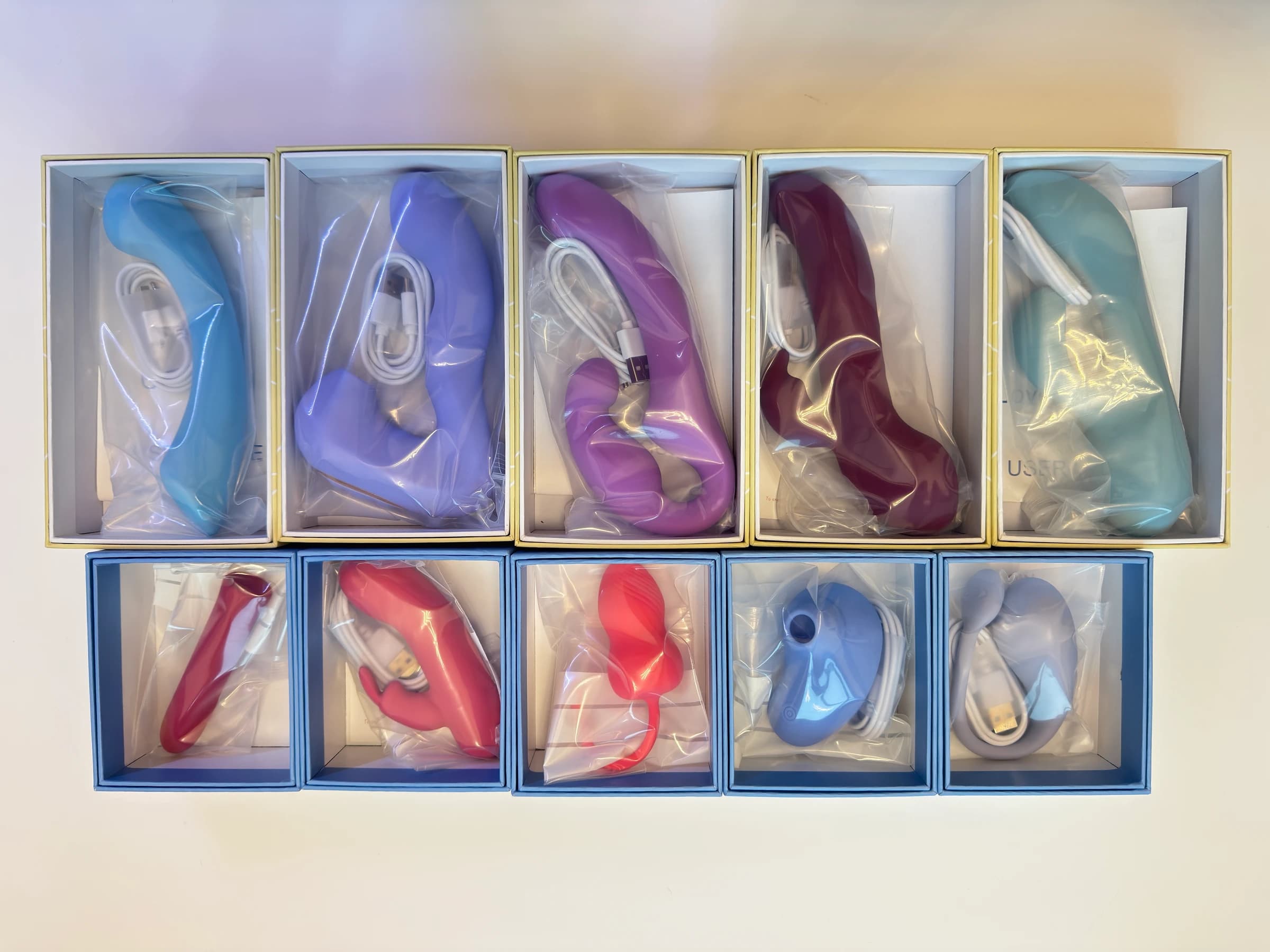 Ten boxed Kyaure product samples with cables and protective bags